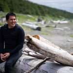 Mallott pictured at Cannon Beach, Yakutat in 2022, while volunteering as a childrens' surf coach with Yakutat Surf Club.